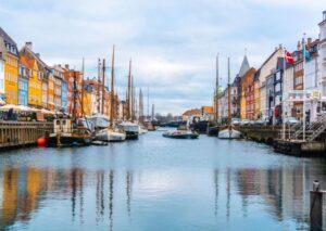 Copenhagen: Guided City Highlights Tour - Nyhavn canal houses: more than postcard color