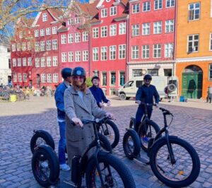 Copenhagen: Guided E-Scooter KickBike Tour- All Highlights - Start at Nikolaj Plads 34: training, helmets, and the ride-ready setup