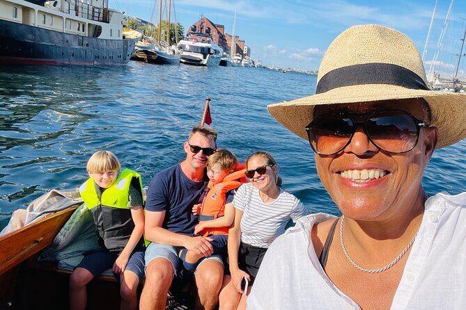 Private Copenhagen Boat cruise in Scandinavian mahogany boat - The Queen’s waterside view: castle, royal yacht possibilities, and major performance buildings